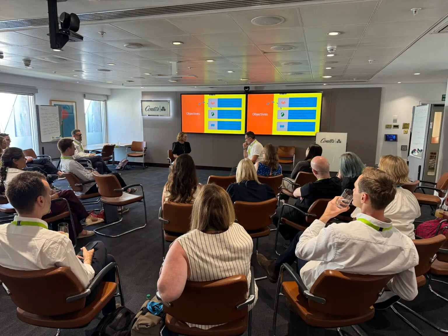 A room of leaders watching a forum theatre scenario